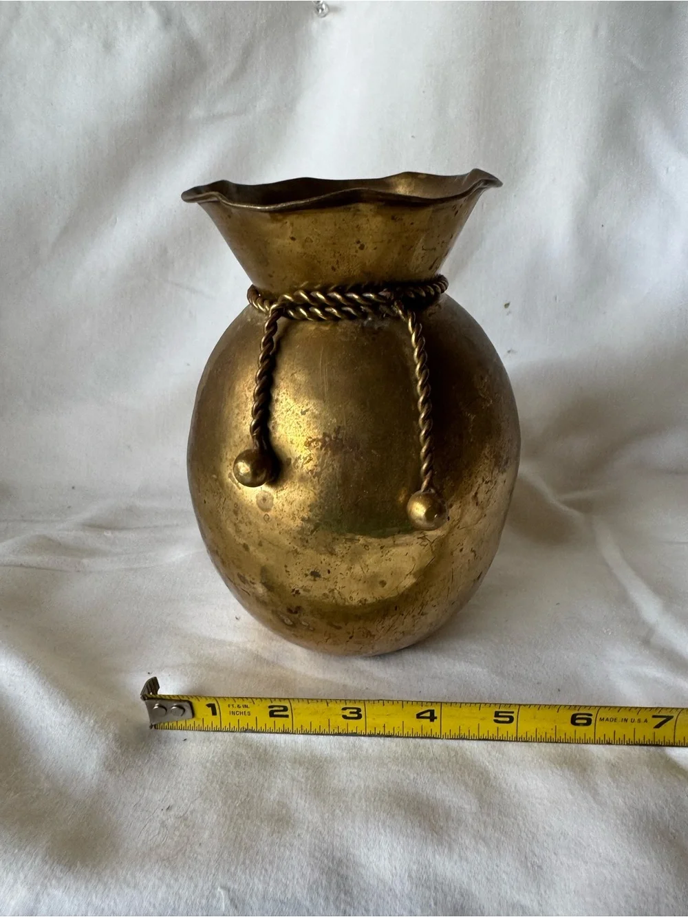 vintage solid brass vase from India featuring a distinctive ruffled rim and a de